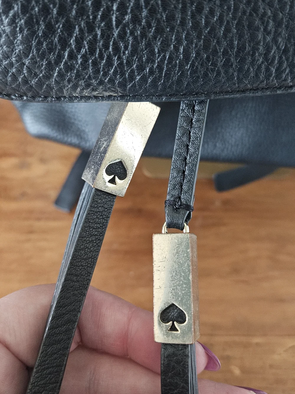 kate spade Black Pebbled Leather Backpack with Tassels